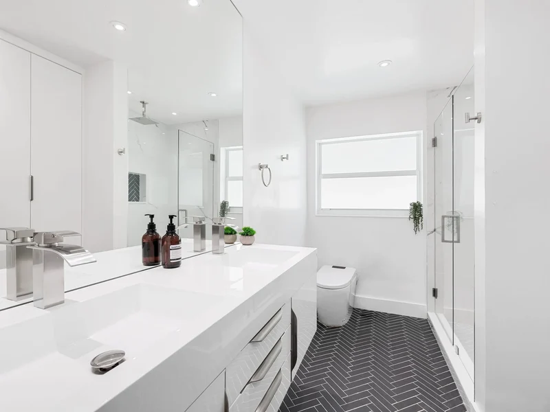 Modern white bathroom with tile floor in St. George, UT