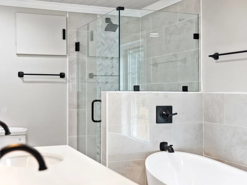 Tiled shower with black fixtures in a Washington County home