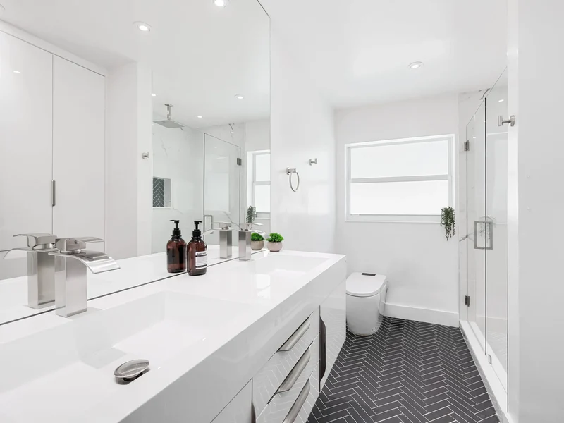 Herringbone floor tile in a modern St. George bathroom